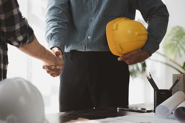 contractors shaking hands at the start of a new project