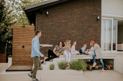 Happy family on a concrete patio in glen burnie md built by brijo concrete